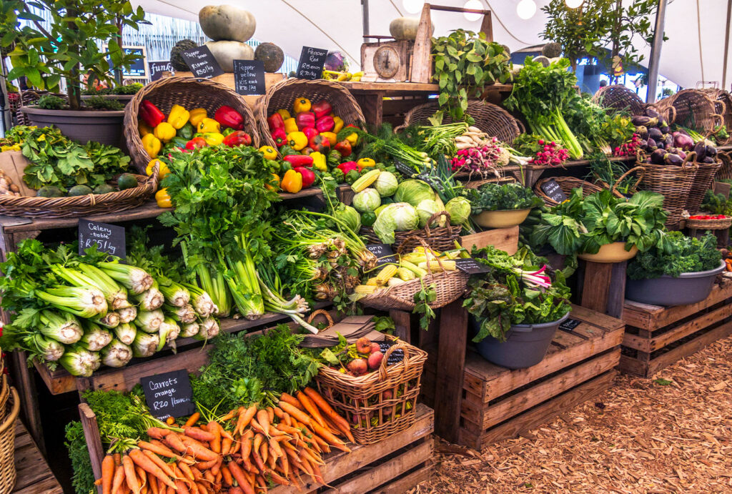 piles of fruits and vegetables, representing the Carroll Gardens Greenmarket, which is a great option to shop for groceries if you're staying in a Carroll Gardens apartment rental